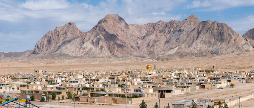 Golden Dome Shrine over Desert Town, Yazd, Iran
