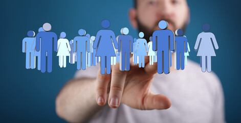 A man's hand reaching towards a group of people silhouettes, symbolizing unity, teamwork, and human...