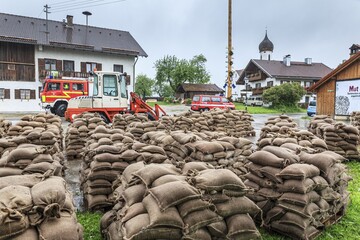 Sandbags, continuous rain, high water, flooding, fire brigade, town, houses, Whitsun floods 2013, climate change, Schlehdorf, Alpine foothills, Bavaria, Germany
