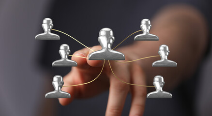 Business concept, leadership teamwork. Hand connects people icons and represents teamwork and a...