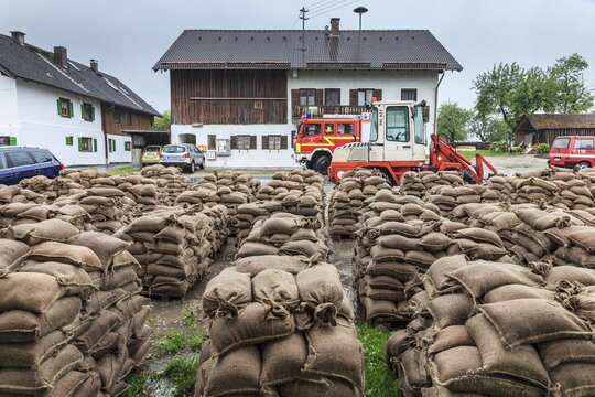 Sandbags, continuous rain, high water, flooding, fire brigade, town, houses, Whitsun floods 2013, climate change, Schlehdorf, Alpine foothills, Bavaria, Germany