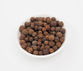 Allspice Berries in White Bowl, Aromatic Spice for Cooking and Flavoring