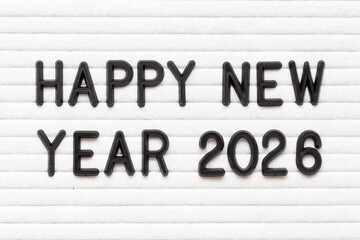Black color letter in word happy new year 2026 on white felt board background