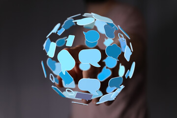Concept of communication network, business, person holding speech bubbles. Connection and conversations are key elements for growth.
