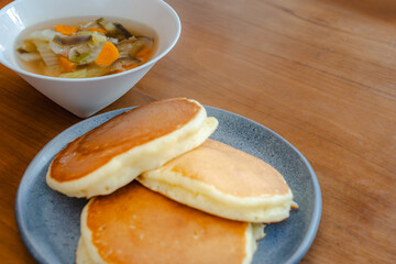 Fluffy pancakes and vegetable soup for breakfast
