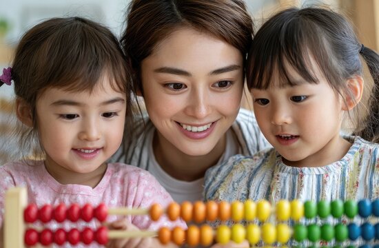 a young japanese woman is playing with an abacus and children
