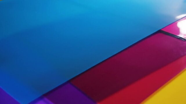 Vibrant Abstract Background with Colorful Overlapping Glossy Sheets.
