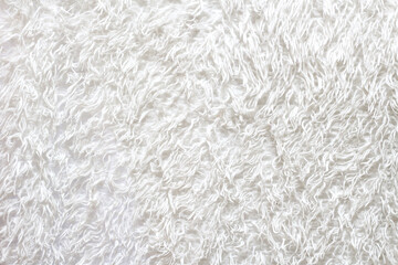 Fluffy white blanket, soft bedspread background.