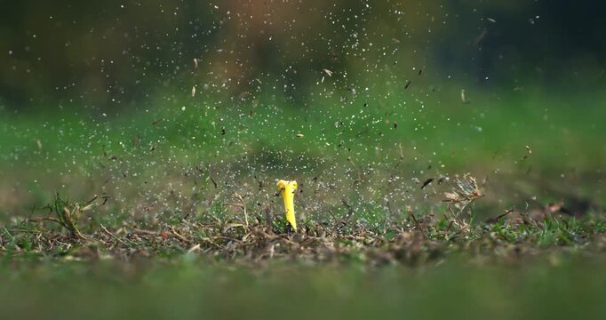 Slow Motion Close Up of Golf Swing Powerful Impact as Club Hits the Ball, Grass and Sand Flying in the Air, Capturing Strength, Focus and Precision at 1000 fps