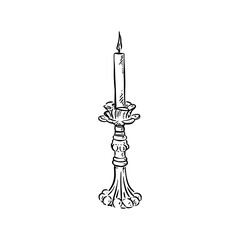 Fototapeta premium Candlestick with candle in top. Wick lit with fire.
