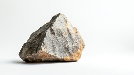Obraz premium Natural rock formation with textured surface displayed on a white background in a simple setting