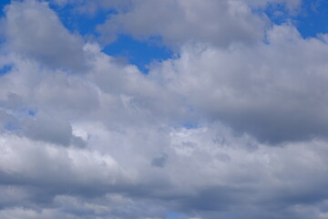 Dramatic layers of cumulus clouds in sky