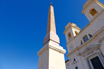 Obraz premium obelisk and Trinità dei Monti church in Rome, Italy. low angle view