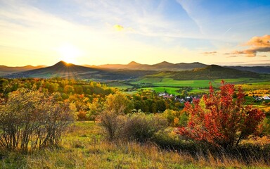 Sunset over the Bohemian Central Mountains. A beautiful view of the autumn landscape
is sought after by domestic and foreign tourists.