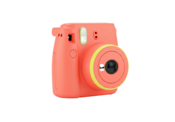 Isolated coral camera in studio, vintage look, modern instant photography gadget for hobbies