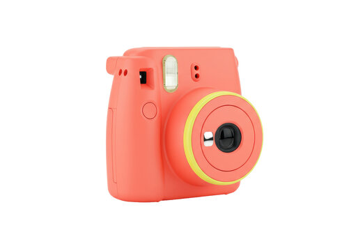 Isolated coral camera in studio, vintage look, modern instant photography gadget for hobbies