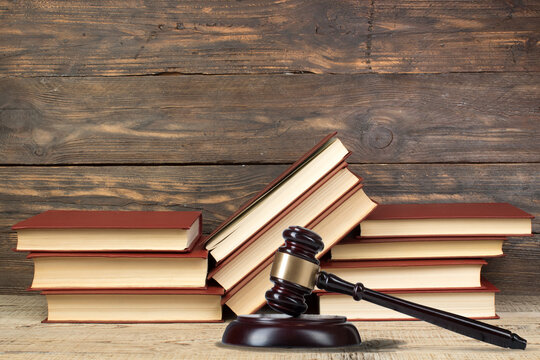 Law and Justice, Legality concept, Judge Gavel on a wooden background, Law library concept.