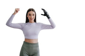 Cute young woman stands at home with  bionic hand prosthesis, smiles, bending hands looks aside on...