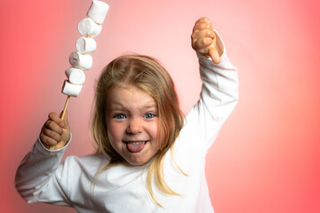 Little girl refusing junk food on colorful studio background. Concept of child health and wellness,...