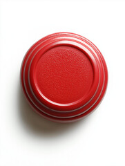 Red round lid with textured surface on white background  