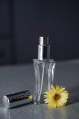 perfume bottle and flower