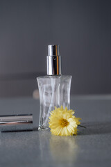 perfume bottle and flower