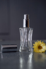 perfume bottle and flower