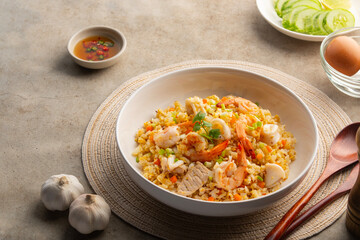 Fried rice seafood,Thai fried rice with pork shrimp and squid in a plate.street food.