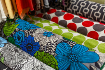 Rolls of floral cotton fabric at the store. Plenty of room for imagination, creativity, and...