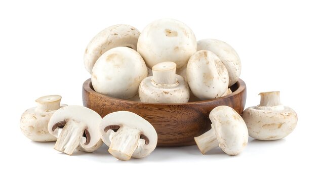 Close-up of white, fresh, whole and sliced fungi in a wooden bowl
