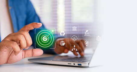 ESG concept, Businessman using digital interface on laptop with environmental, social, and...