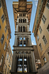 Wrought-iron tower of the Elevador de Santa Justa in downtown Lisbon, Portugal, shot from below against a clear sky and emphasising its ornate industrial structure