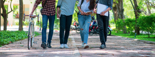 Group of Diversity Student working and walking together in park at university,Happy multiethnic friend study in asian college.Multiethnic and diversity student Concept