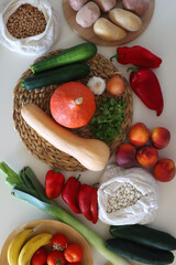 Collection of healthy fruits, vegetables and legumes on white background. Top view.