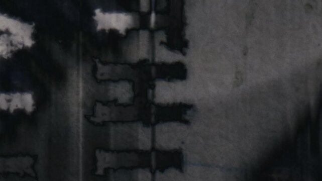 Grungy, vintage microfiche-style transitions for dynamic video edits. Ideal for historical or technological themes