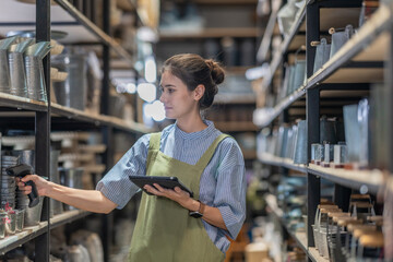 A Female Entrepreneur in a Family Run Ceramic Business Checking Stock