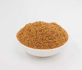 Fine Grained Brown Spice In White Bowl On Clean White Background