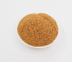 Fine Grained Brown Spice In White Bowl On Clean White Background
