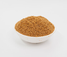 Fine Grained Brown Spice In White Bowl On Clean White Background