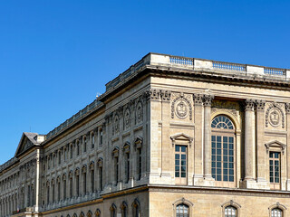 Classical Facade of the Louvre Museum on a Clear Day in July 