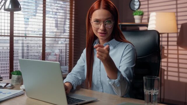 Caucasian business woman in office typing laptop pointing finger hey you come here businesswoman female girl inviting join to work invitation to consultation smiling friendly HR manager recruiter