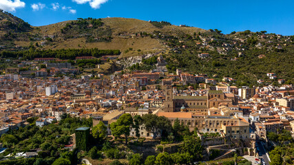 Obraz premium Aerial view of the town of Monreale, in the metropolitan city of Palermo, Sicily, Italy. It's a small town at the foot of a mountain. The cathedral in the historic center is a World Heritage Site.