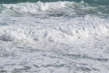 Fototapeta premium Natural marine background of stormy sea surface, powerful waves and white foam