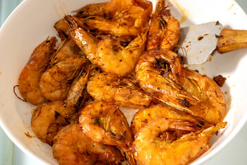Fried shrimps and langoustines on a plate. Close-up of fried shrimps and langoustines.