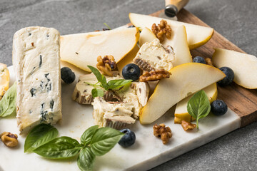 Pear with Dor Blue cheese on marble board
