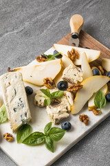 Pear with Dor Blue cheese on marble board