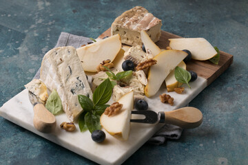 Pear with Dor Blue cheese on marble board