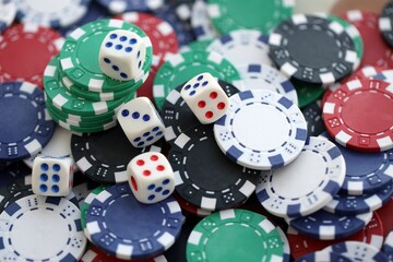 Dice game on the poker table in the casino. A successful combination of dice brought a lot of winning chips