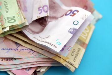 Big amount of different Ukrainian hryvnia money bills. Pile of crumpled ukrainian banknotes