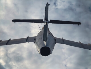 old Russian military fighter jet flies in the sky
